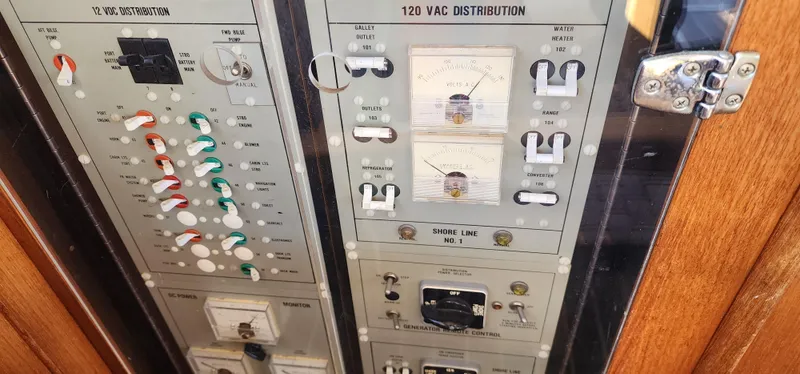 Slide: The Image of Electrical panel of 1985 Bertram 33 Flybridge Cruiser with switches and gauges. - 25