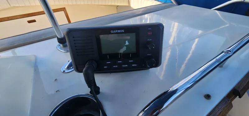 Slide: The Image of Garmin device on 1985 Bertram 33 Flybridge Cruiser dashboard. - 5