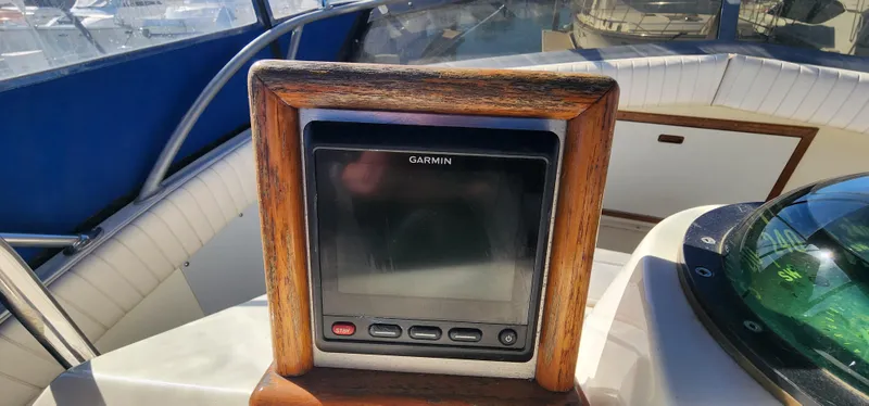 Slide: The Image of Garmin navigation system on 1985 Bertram 33 Flybridge Cruiser boat dashboard. - 6