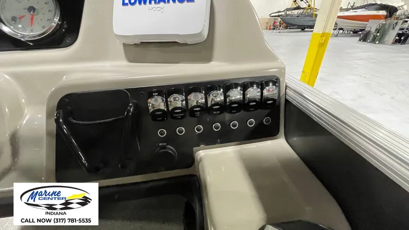 Slide: The Image of Control panel of 2020 Barletta C22QC boat with switches and gauges in a showroom. - 10