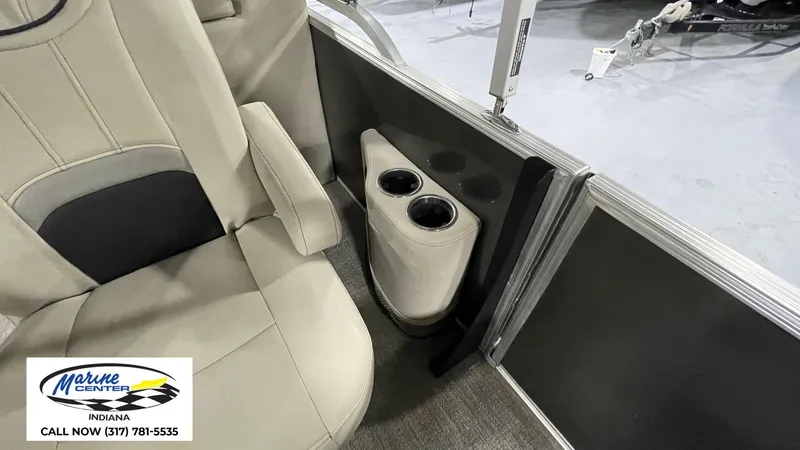 Slide: The Image of Interior of 2020 Barletta C22QC boat with beige seating and cup holders. - 16