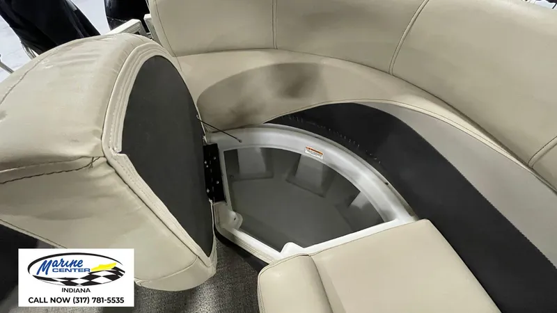 Slide: The Image of Interior seating storage of 2020 Barletta C22QC pontoon boat, featuring beige upholstery. - 3