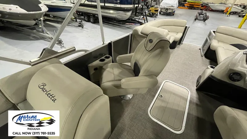 Slide: The Image of 2020 Barletta C22QC pontoon boat interior at Marine Center Indiana showroom. - 4