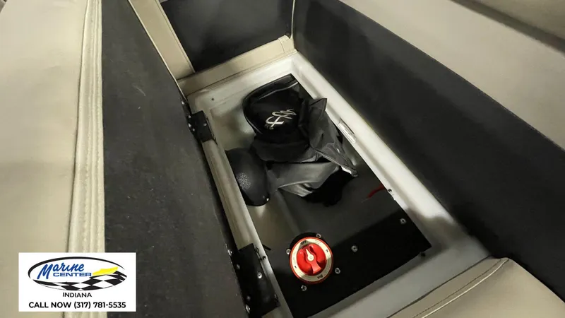 Slide: The Image of Storage compartment in a 2020 Barletta C22QC boat with safety equipment. - 5