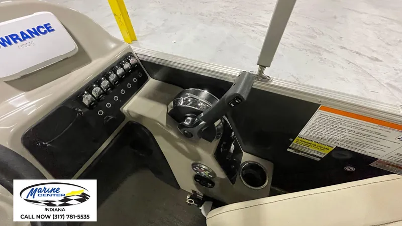 Slide: The Image of Control panel of a 2020 Barletta C22QC boat with throttle and switches. - 8