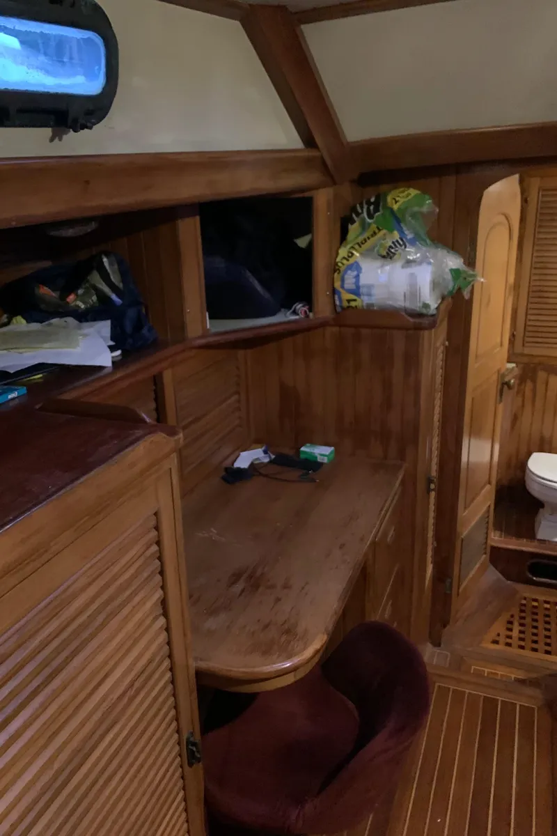 Slide: The Image of 1983 Liberty Center Cockpit interior with wooden furnishings and compact design. - 25