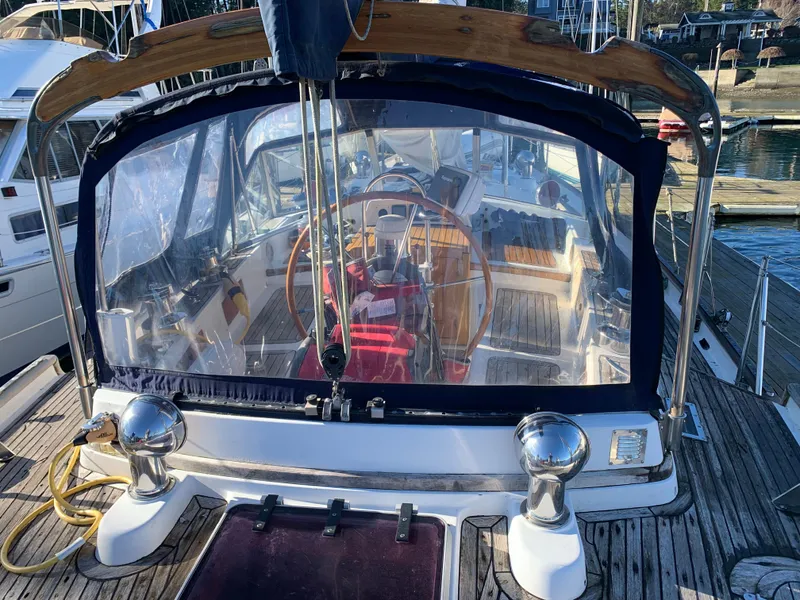 Slide: The Image of 1983 Liberty Center Cockpit sailboat with wooden deck and clear cockpit enclosure. - 8