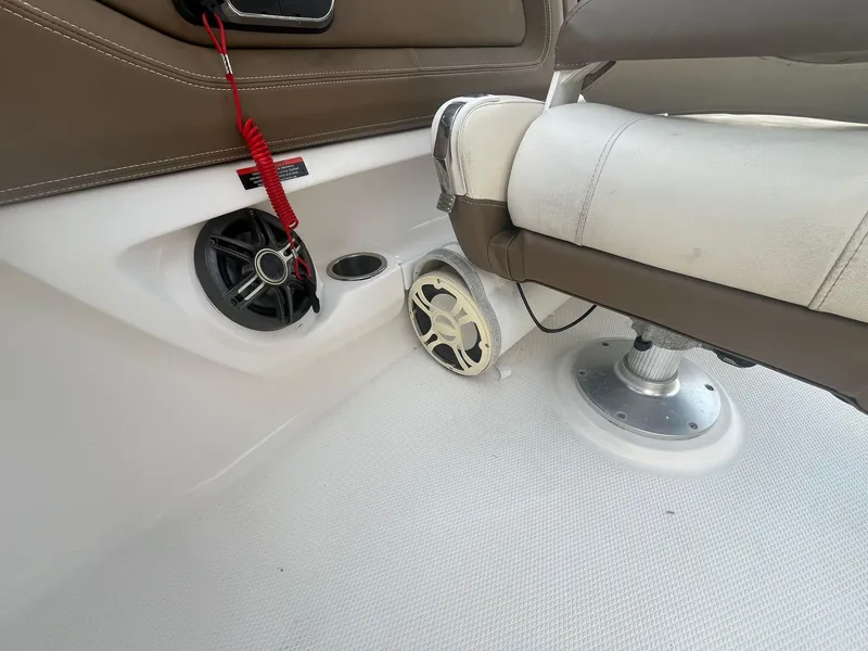 Slide: The Image of 2013 Chaparral 257 SSX boat interior with speakers and seating. - 25