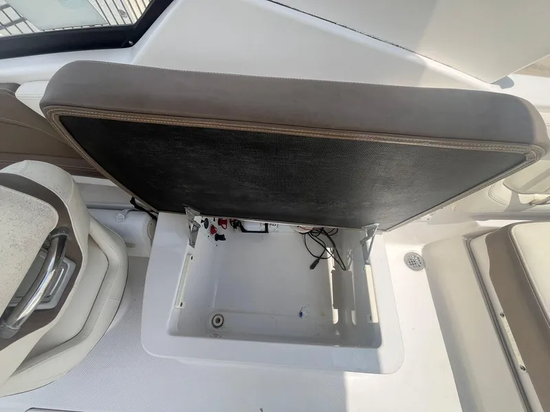 Slide: The Image of Open storage compartment in 2013 Chaparral 257 SSX boat interior. - 29