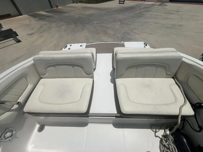Slide: The Image of 2013 Chaparral 257 SSX boat with white cushioned seating. - 33