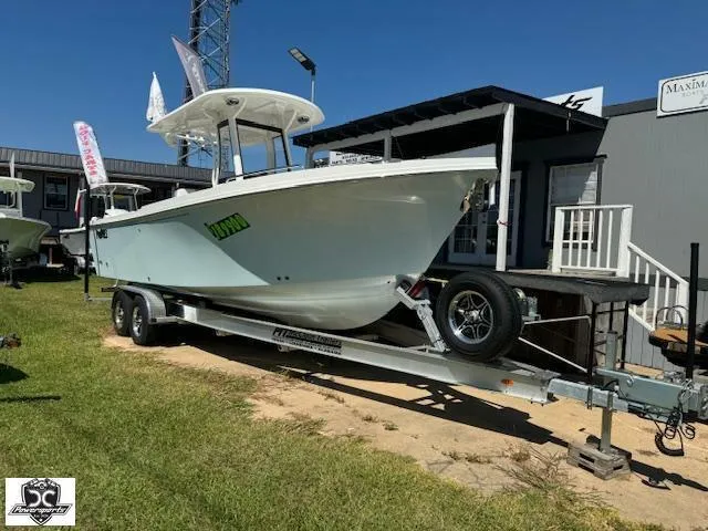 Slide: The Image of 2025 Parker 2600 Center Console boat on trailer, displayed outdoors. - 3