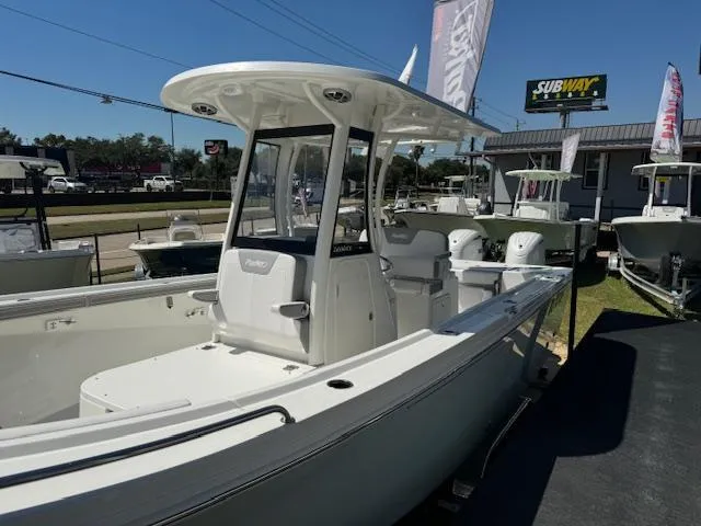 Slide: The Image of 2025 Parker 2600 Center Console boat displayed outdoors near a Subway sign. - 4
