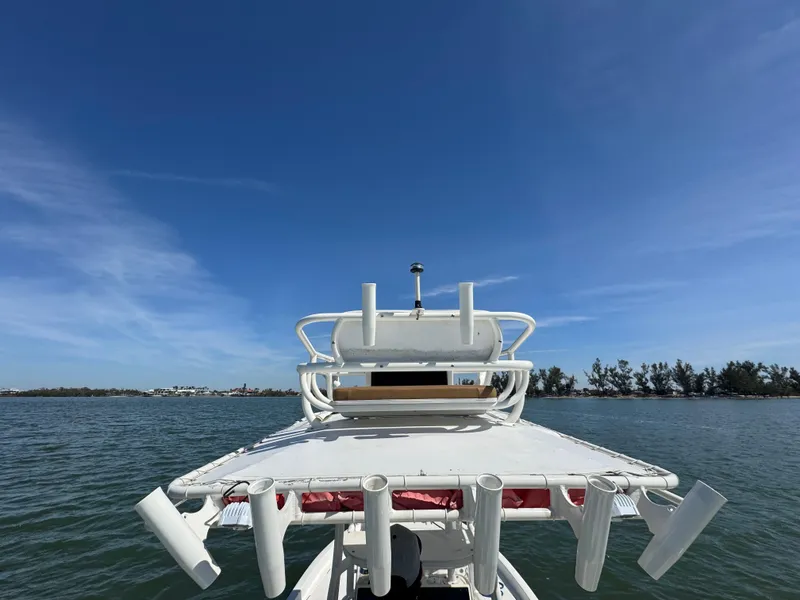 Slide: The Image of 2022 Skeeter SX230 boat on water under clear blue sky. - 18