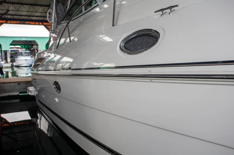 Slide: The Image of 2003 Cruisers Yachts 3275 Express docked in a marina, side view. - 19