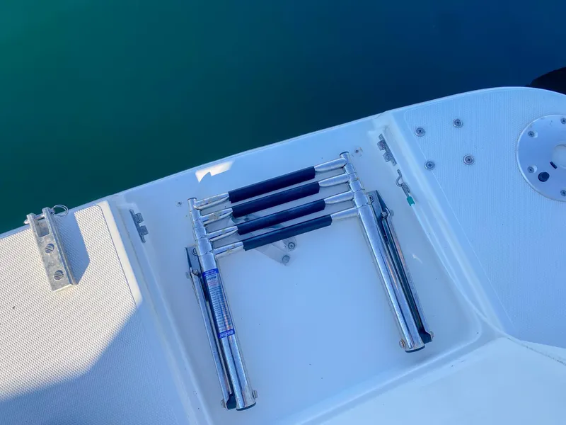Slide: The Image of Folded swim ladder on 2003 Cruisers Yachts 3275 Express boat deck. - 8