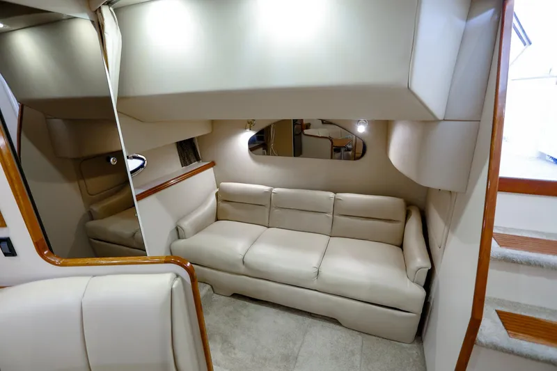 Slide: The Image of 2003 Cruisers Yachts 3275 Express interior with beige sofa and modern design. - 30