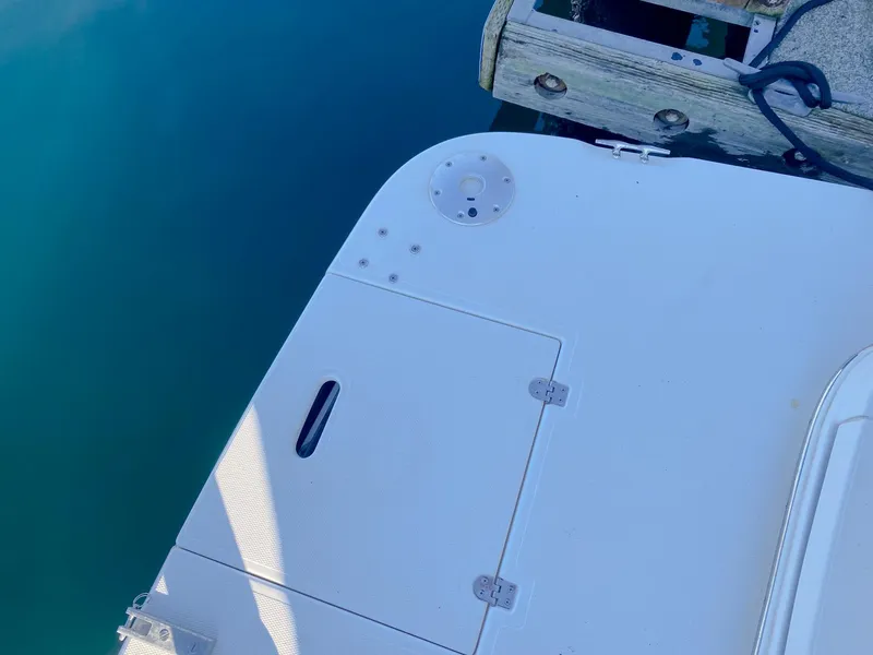 Slide: The Image of 2003 Cruisers Yachts 3275 Express swim platform at dockside. - 7