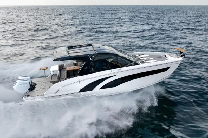 Slide: The Image of 2025 Hanover 387 Classic Luxury Edition OB cruising on open water. - 0