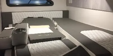 Slide: The Image of Interior of 2025 Hanover 387 Outboard Classic Luxury Edition, featuring elegant seating and modern design. - 12