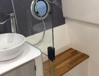 Slide: The Image of Luxury bathroom interior of 2025 Hanover 387 Outboard Classic, featuring modern sink and wooden accents. - 16