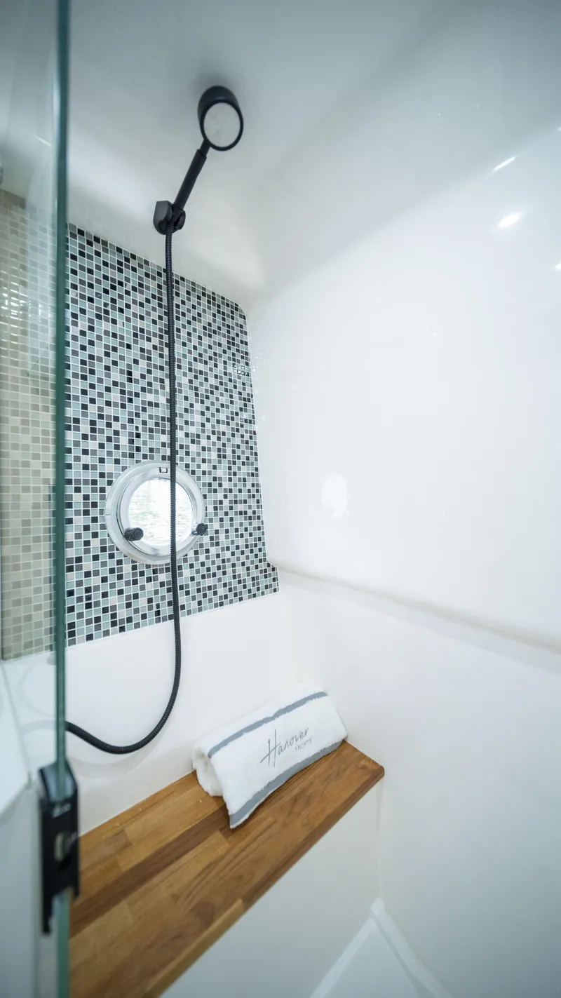 Slide: The Image of Luxury shower in 2025 Hanover 387 Outboard Classic, featuring modern design and mosaic tiles. - 17