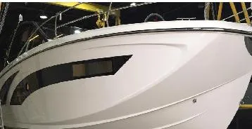 Slide: The Image of 2025 Hanover 387 Outboard Classic Luxury Edition boat, sleek white exterior design. - 2