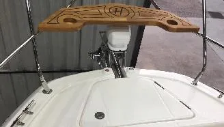 Slide: The Image of 2025 Hanover 387 Outboard Classic Luxury Edition boat deck with wooden accents. - 5