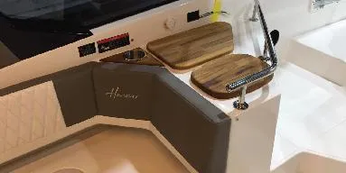 Slide: The Image of 2025 Hanover 387 Outboard Classic Luxury Edition interior with elegant seating and wooden accents. - 7