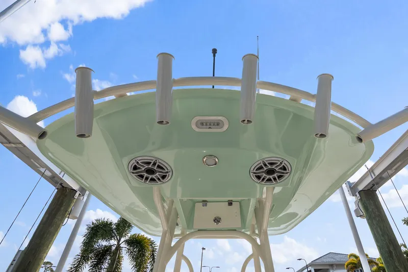 Slide: The Image of 2023 Pathfinder 2700 Open boat, underside view with speakers and rod holders. - 13