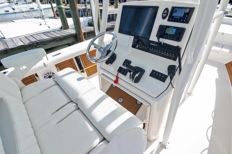 Slide: The Image of 2023 Pathfinder 2700 Open boat console with modern controls and seating. - 15