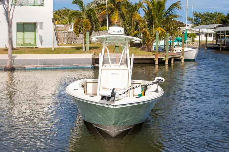 Slide: The Image of 2023 Pathfinder 2700 Open boat docked in a scenic waterfront setting. - 3