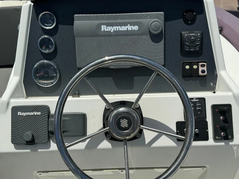 Slide: The Image of Steering wheel and dashboard of 2017 Beneteau Swift Trawler 34 with Raymarine equipment. - 41
