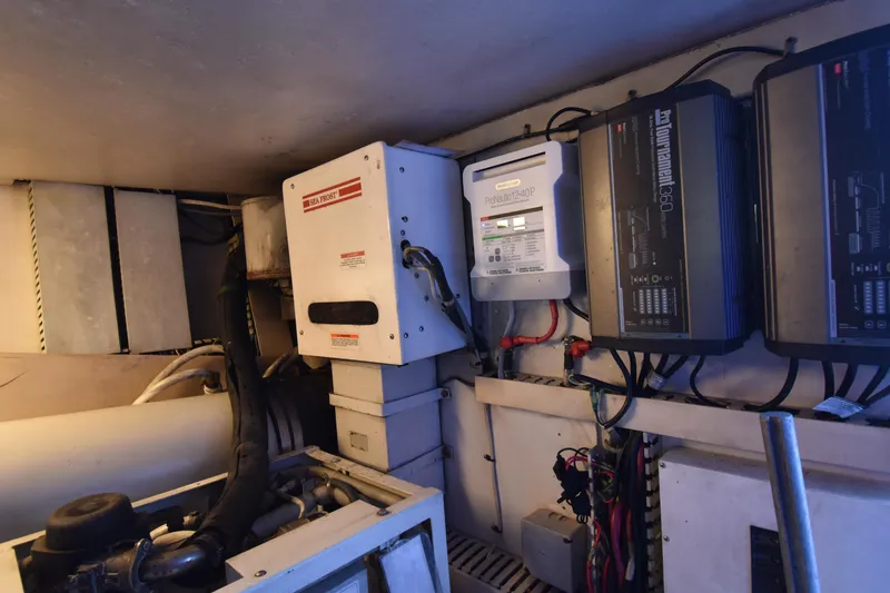 Slide: The Image of Engine room of a 1997 Viking 53 Convertible with electrical equipment and wiring. - 21
