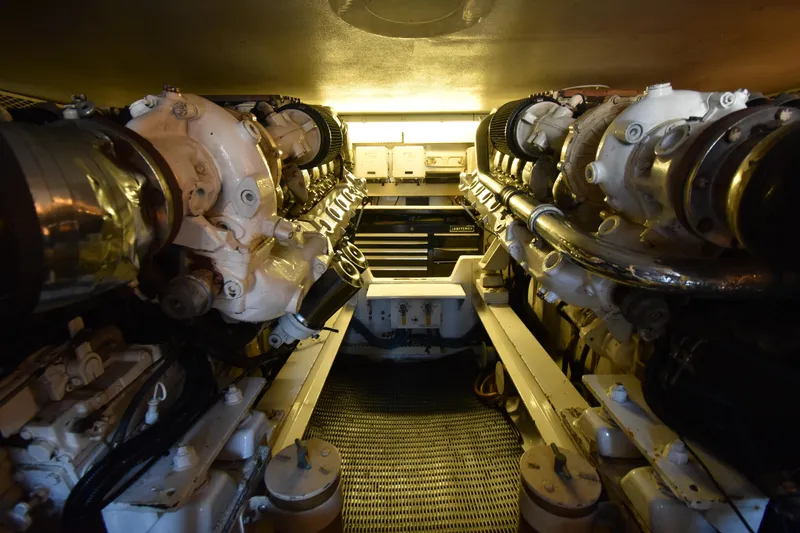 Slide: The Image of Engine room of a 1997 Viking 53 Convertible yacht, showcasing dual engines. - 24