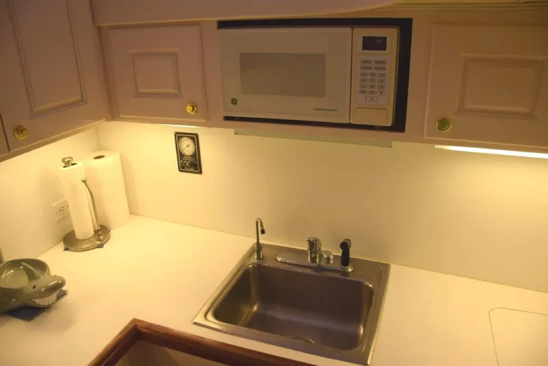 Slide: The Image of Microwave and sink, under counter lighting - 13