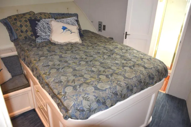 Slide: The Image of Walkaround queen berth with changing seats on either side of berth - 15