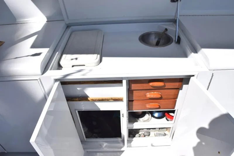 Slide: The Image of Cockpit tackle center with sink and cooler - 30