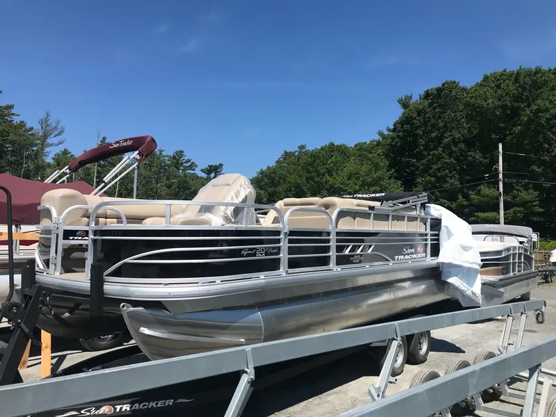 Slide: The Image of 2023 Sun Tracker SportFish 20 DLX pontoon boat on trailer, outdoors. - 8