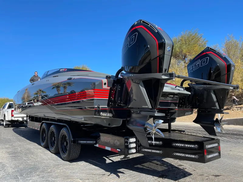 Slide: The Image of 2021 Daves Custom Boats M-37R on trailer, featuring dual engines and sleek design. - 3