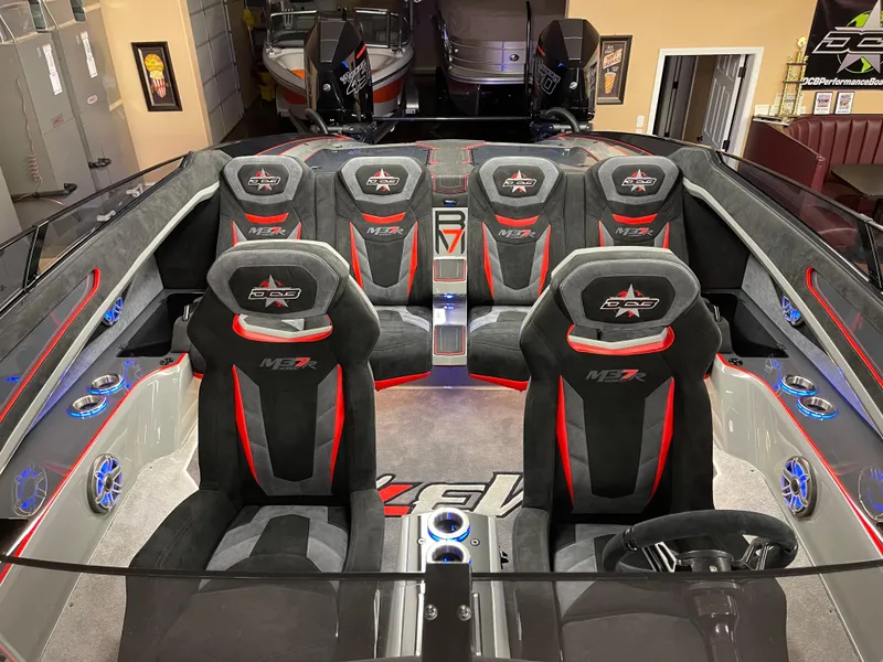 Slide: The Image of 2021 Daves Custom Boats M-37R interior with black and red seating, sleek design. - 5