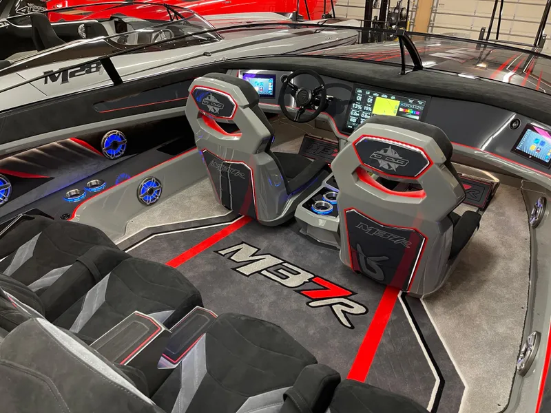 Slide: The Image of 2021 Daves Custom Boats M-37R interior with modern dashboard and seating. - 8