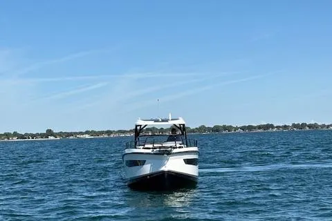 Slide: The Image of 2025 Navan C30 boat cruising on a calm blue sea under a clear sky. - 13