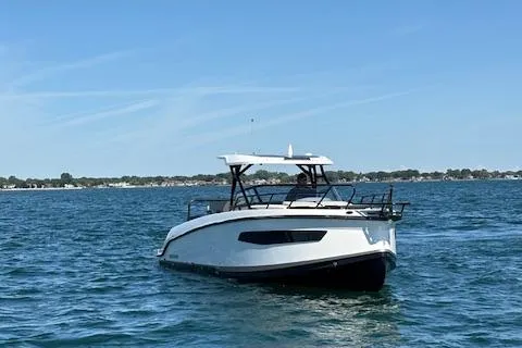 Slide: The Image of 2025 Navan C30 boat cruising on a calm blue sea under a clear sky. - 14