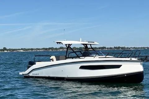 Slide: The Image of 2025 Navan C30 boat cruising on a sunny day in open water. - 15