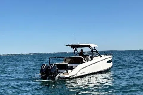 Slide: The Image of Navan C30 2025 boat cruising on open water under clear blue sky. - 17