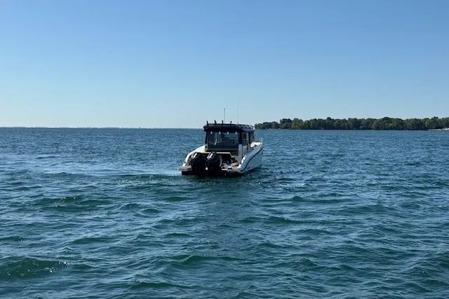 Slide: The Image of Navan C30 boat cruising on a clear blue lake, 2025 model. - 20