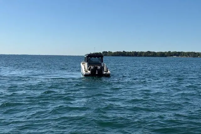 Slide: The Image of Navan C30 boat cruising on a clear blue lake, 2025 model. - 22