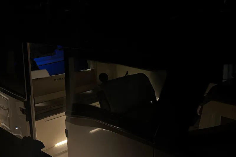 Slide: The Image of Dimly lit interior of a 2025 Navan C30 boat at night. - 28
