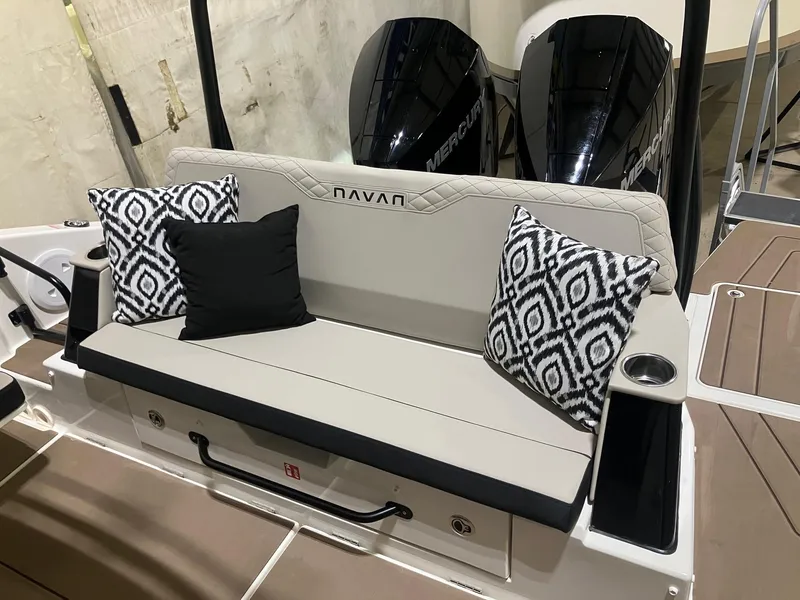 Slide: The Image of Navan C30 2025 boat interior with cushioned seating and patterned pillows. - 3