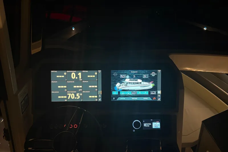 Slide: The Image of Dashboard of 2025 Navan C30 boat with digital displays and controls. - 30